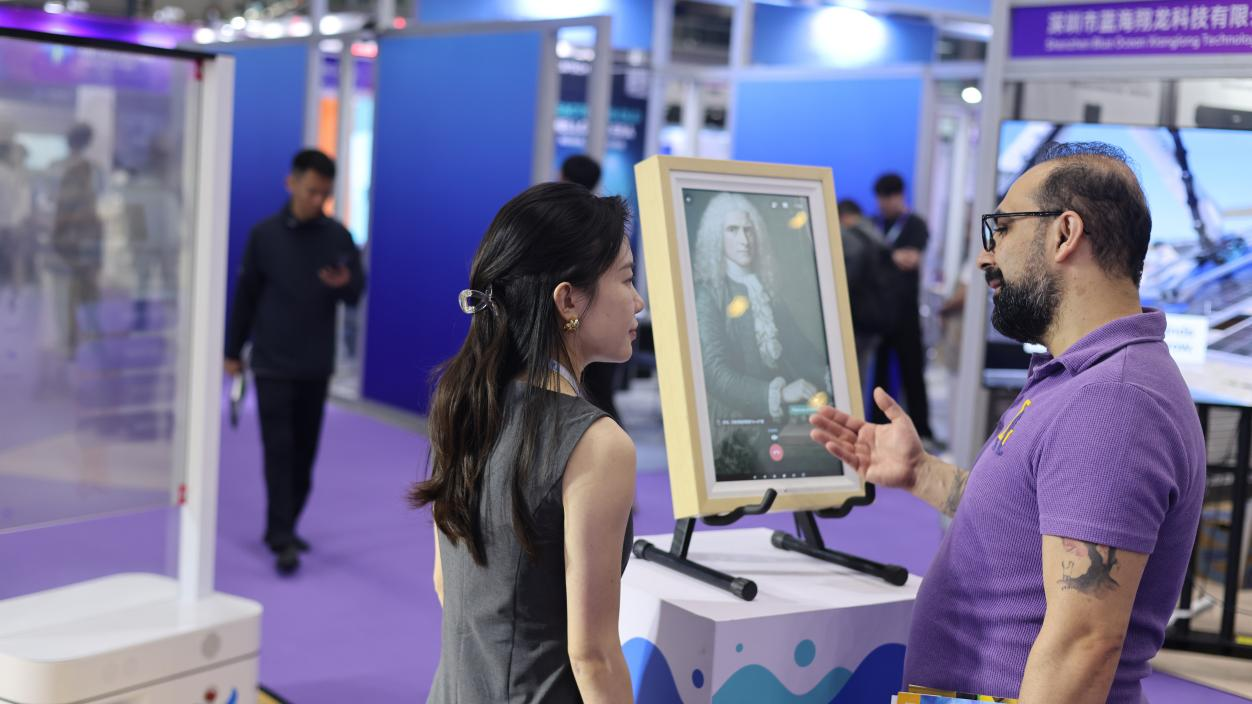 Visitors holding real-time conversations with a LinkseaAI Digital Human at GAIE 2026